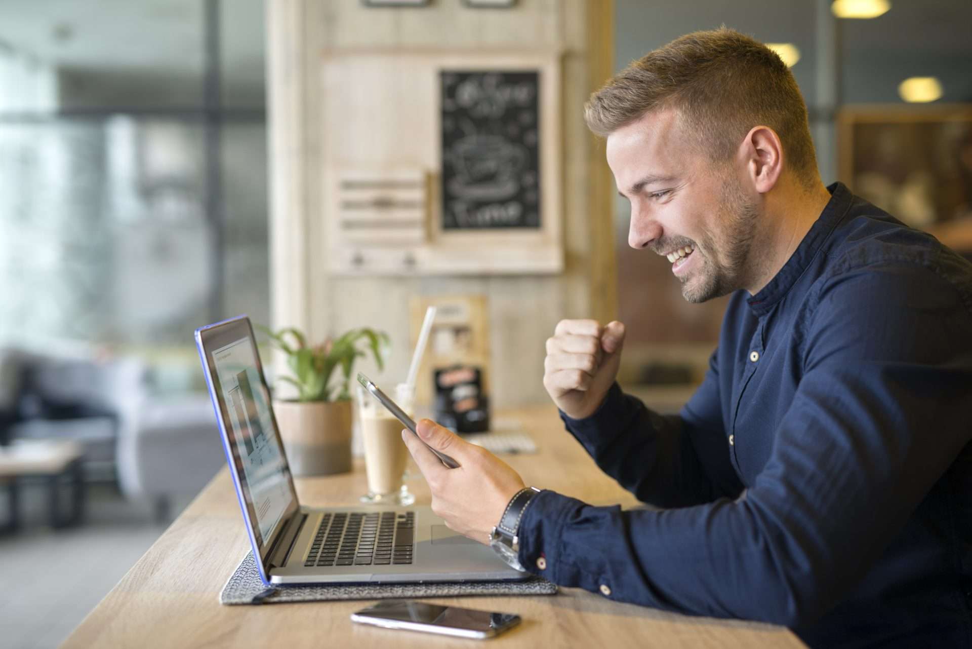 happy freelancer with tablet laptop - interloop